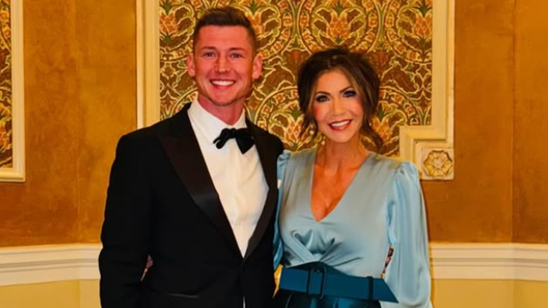 Kyle Peters and Kristi Noem posing together.