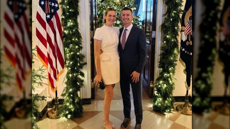 Kassidy Noem Peters and Kyle Peters posing together at a White House Christmas party.