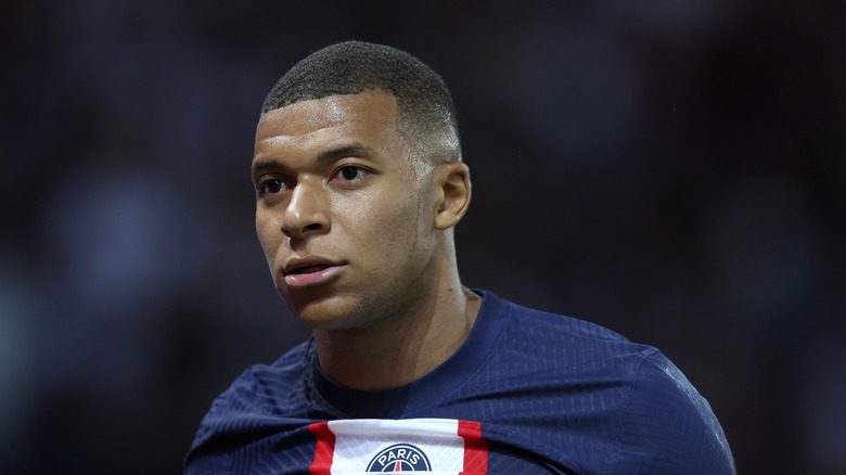 Kylian Mbappé looking away