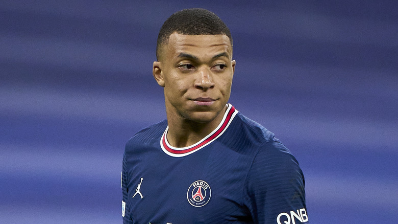 Kylian Mbappé in blue jersey