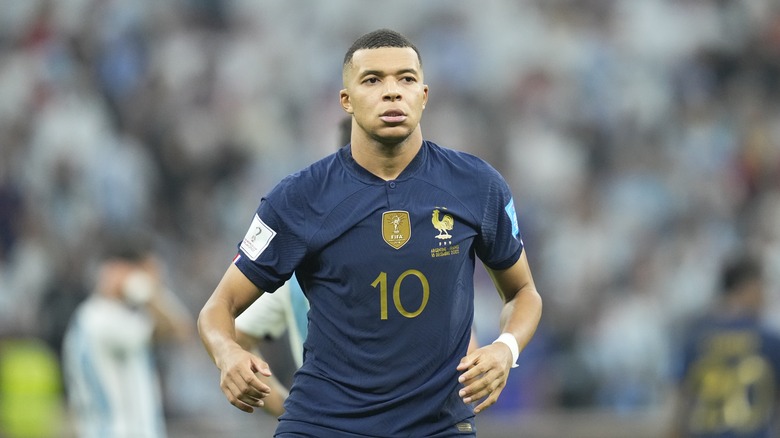 Kylian Mbappé runs on the pitch