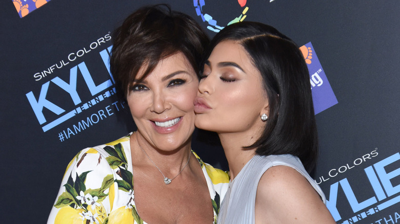 Kylie kissing Kris Jenner on the cheek