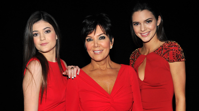 Kylie, Kris, and Kendall Jenner pose in red dresses