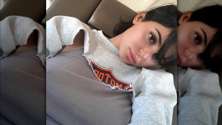 Kylie Jenner posing in cropped sweatshirt