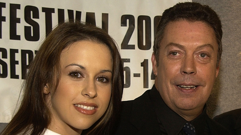 Lacey Chabert and Tim Curry posing together in 2002