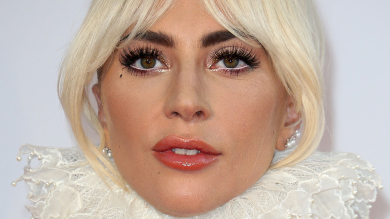 Lady Gaga smiles on the red carpet