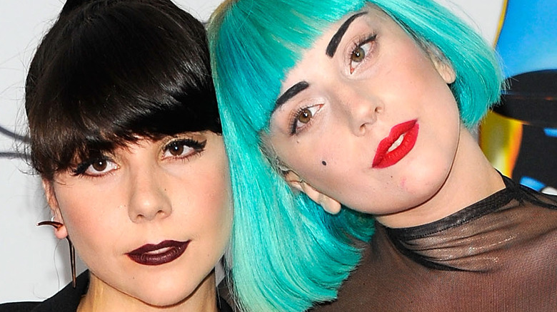 Lady Gaga posing with head on sister Natali Germanotta's shoulder