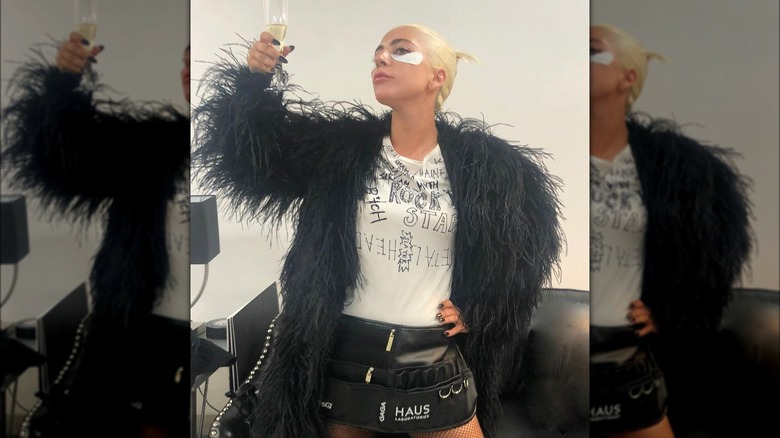 Lady Gaga raising a glass