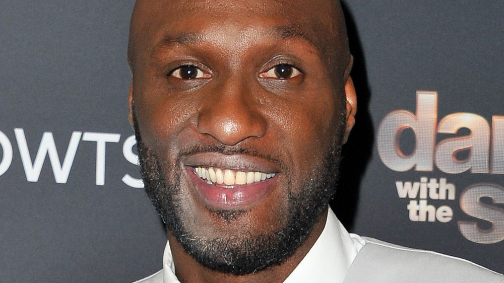 Lamar Odom smiling on the red carpet