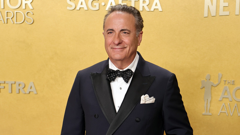 Andy Garcia in a black tuxedo and black polka dot bowtie