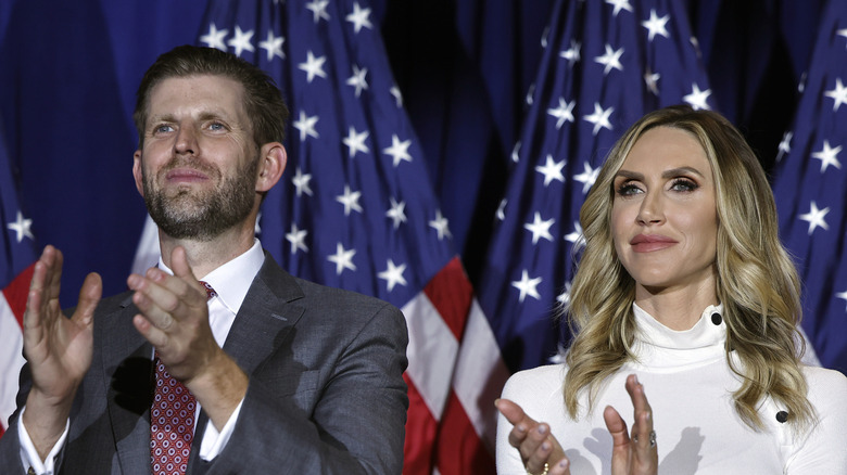 Eric Trump and Lara Trump clapping