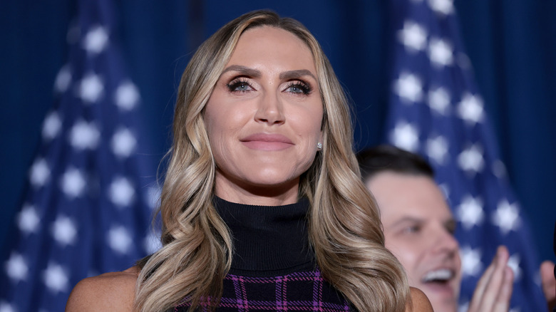 Lara Trump smiles on a stage