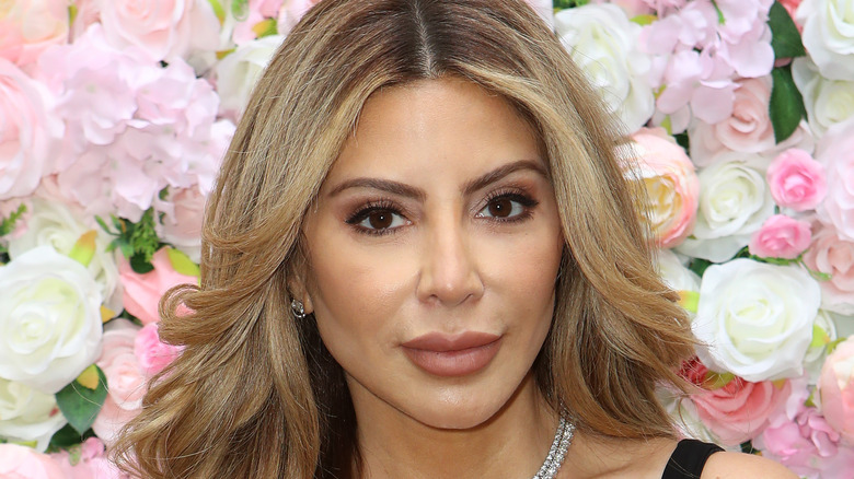 Larsa Pippen with flowers behind her