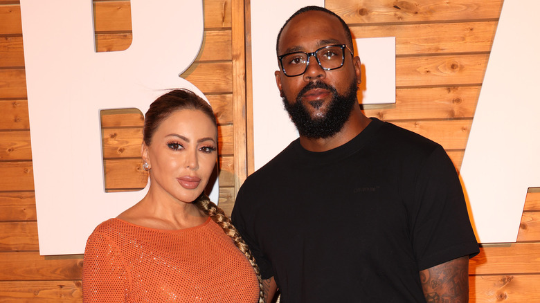 Larsa Pippen, Marcus Jordan posing