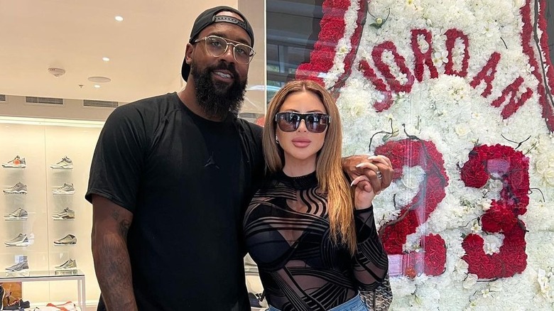 Marcus Jordan, Larsa Pippen holding hands