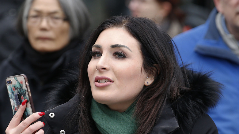 Laura Loomer stands in a crowd in 2019
