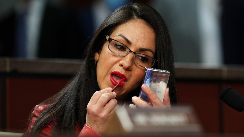 Lauren Boebert applying lipgloss at the Capitol.
