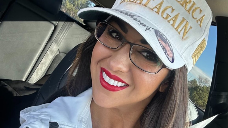 Lauren Boebert smiling in a car