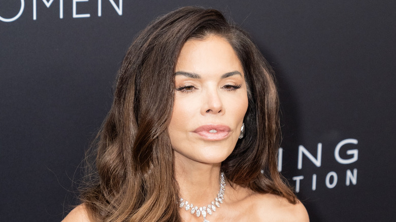 Lauren Sánchez Bezos pursing her lips on the red carpet with a diamond necklace