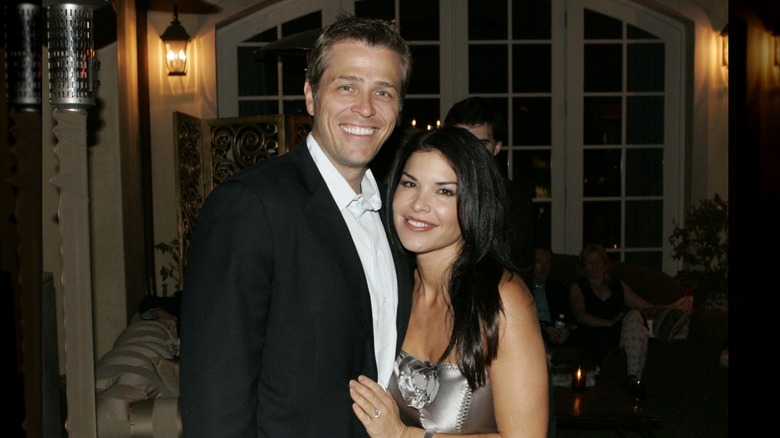 Lauren Sánchez leans close to her ex-husband, Patrick Whitesell, and shares in a joyful smile.