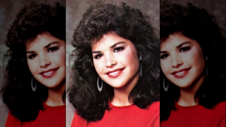 Sporting a red shirt and puffy hair, Lauren Sánchez smiles for a school picture