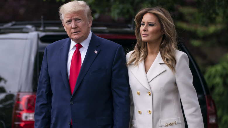 Donald and Melania Trump walking  
