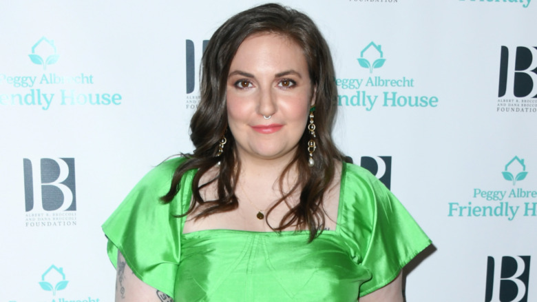 Lena Dunham smiling, wearing a nose ring 