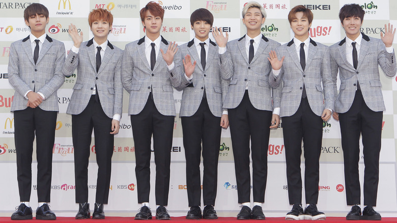 BTS members waving in row