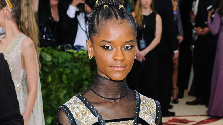 Leticia Wright posing on the red carpet