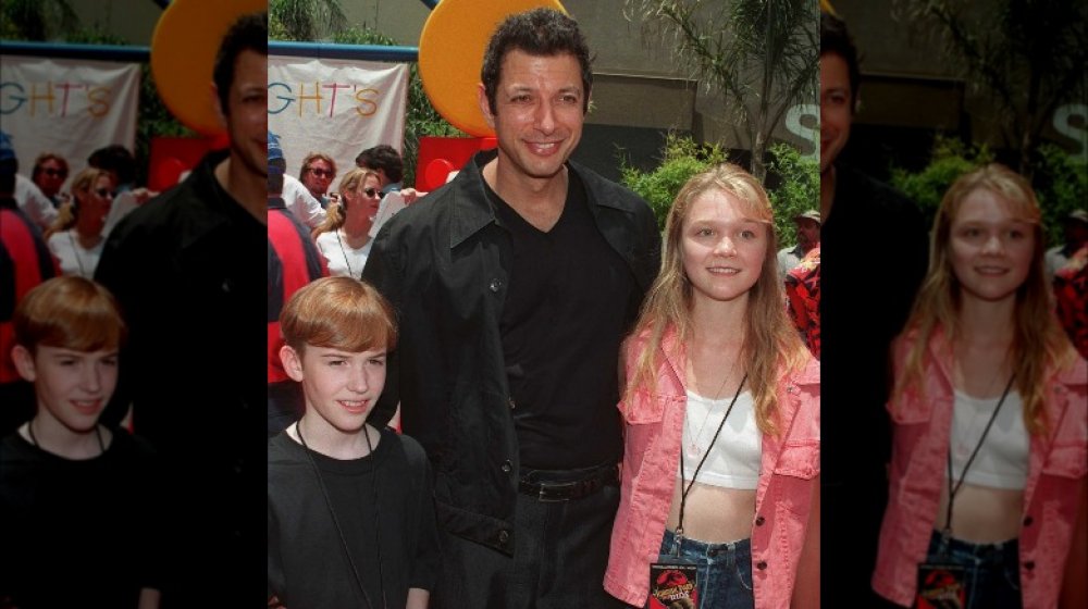Joseph Mazzello, Jeff Goldblum, and Ariana Richards posing at an event