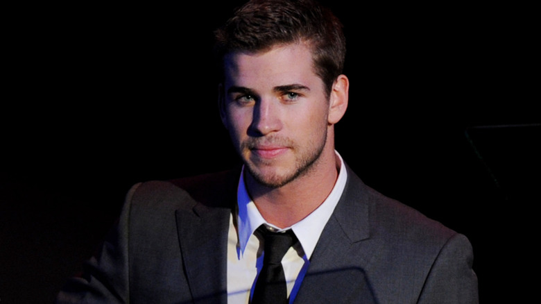 Liam Hemsworth looking away