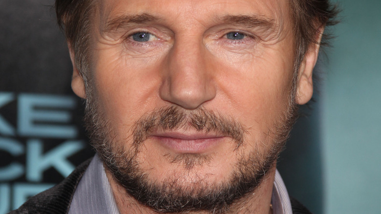 Liam Neeson with a neutral expression