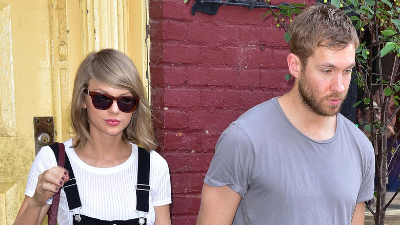 Taylor Swift and Calvin Harris walking