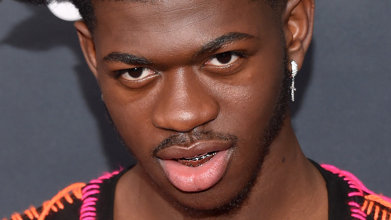 Lil Nas X with a neutral expression