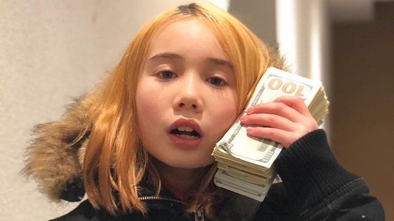 Lil Tay with a wad of cash