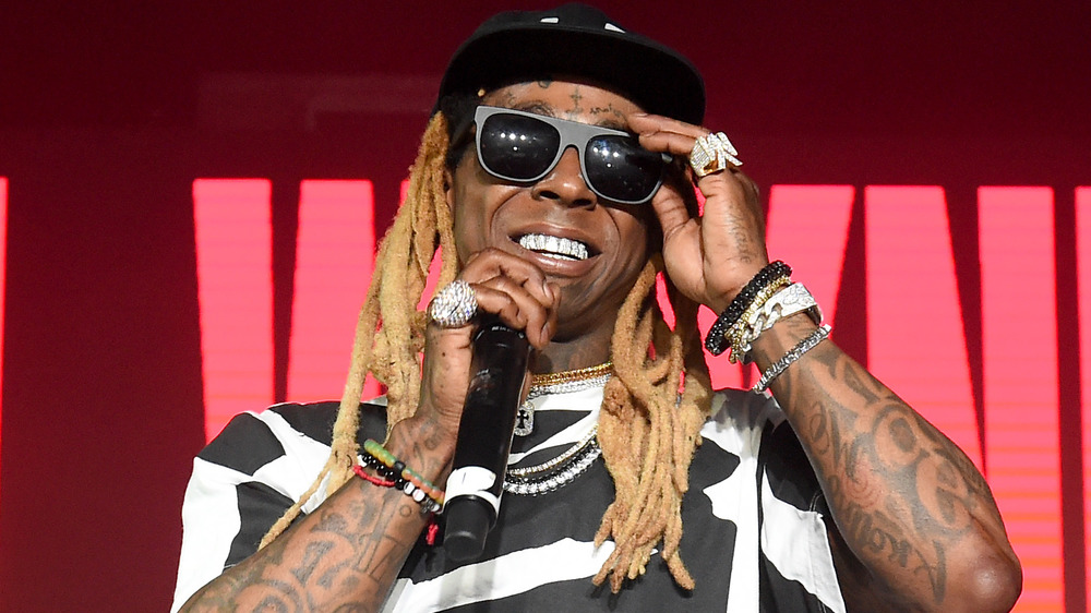 Lil Wayne smiling on stage