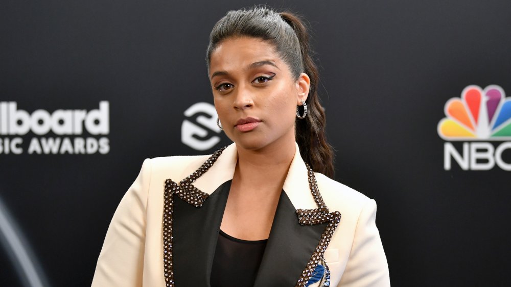 Lilly Singh posing with a neutral expression