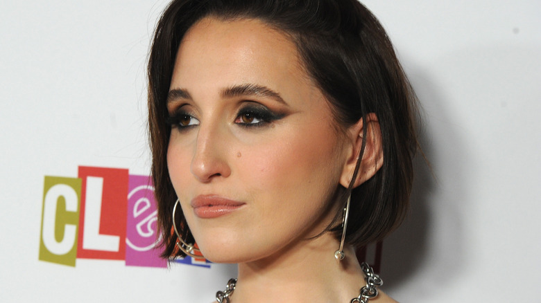 Harley Quinn Smith posing for photo on red carpet