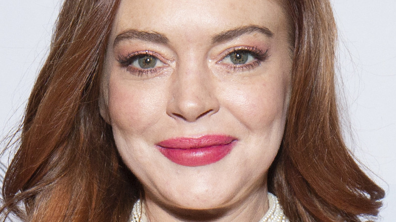 Lindsay Lohan smiles with mouth closed