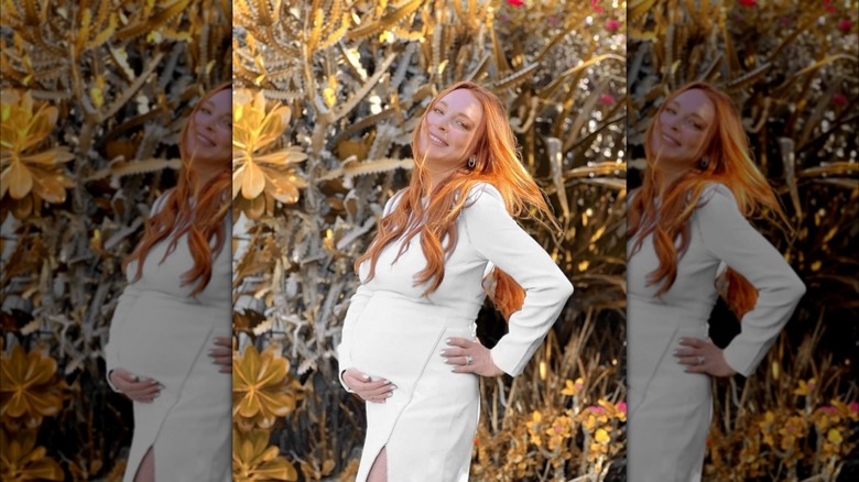 Lindsay Lohan smiling with pregnancy belly
