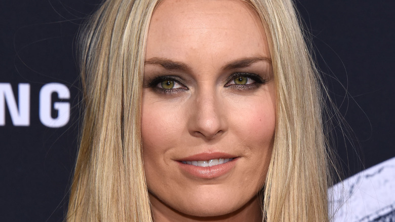 Lindsey Vonn gives a slight smile on the red carpet