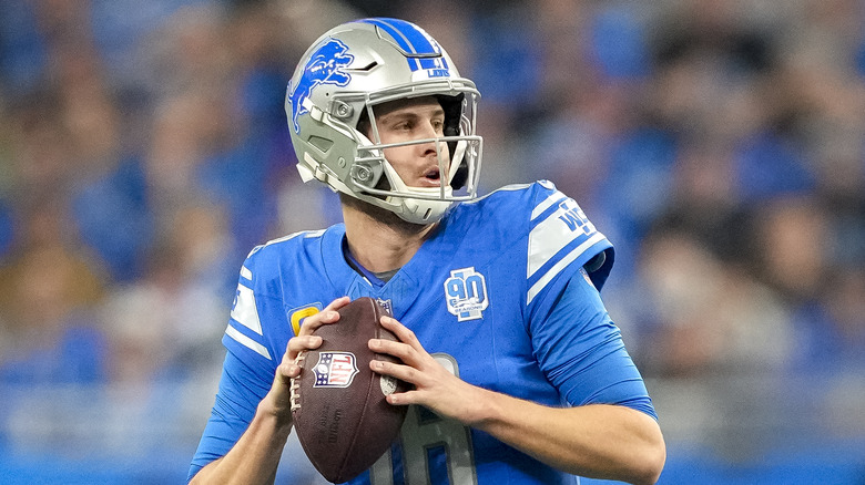 Jared Goff preparing to pass football on field