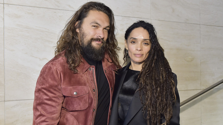 Jason Momoa and Lisa Bonet posing