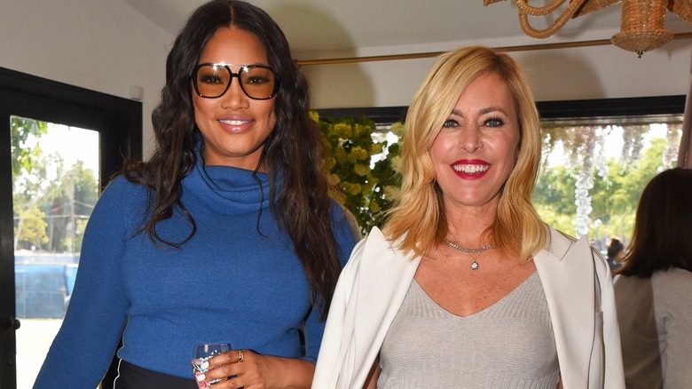 Garcelle Beauvais and Sutton Stracke pose and smile