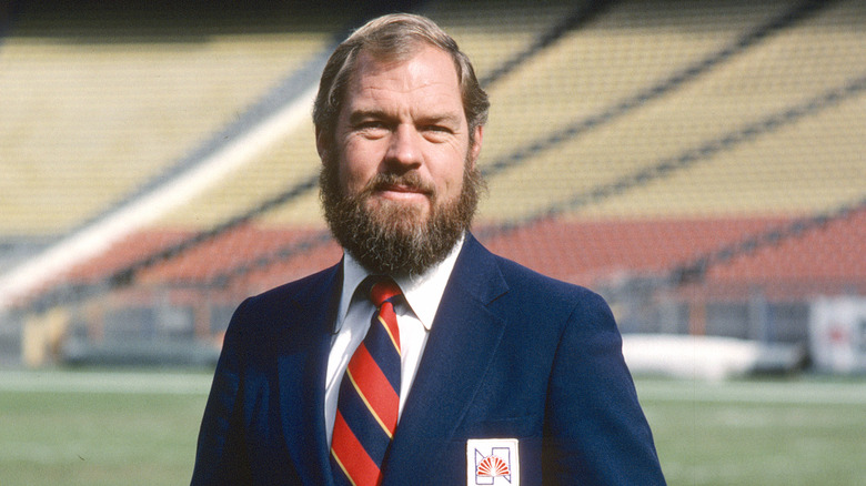 Merlin Olsen posing on football field