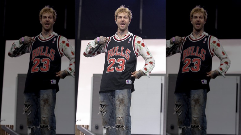 Jesse Rutherford pointing at his jersey