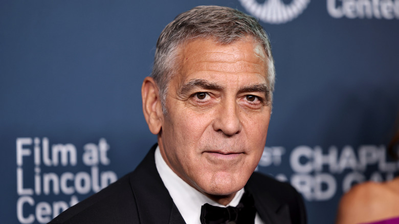 George Clooney smiling on the red carpet