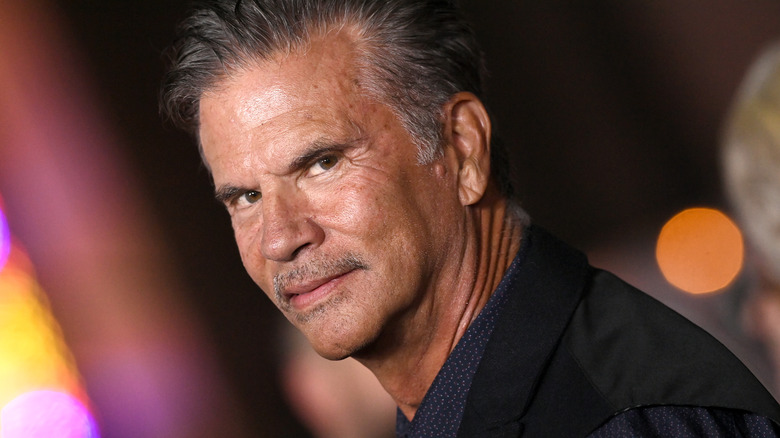 Lorenzo Lamas glancing over his shoulder in a dark suit at the premiere for "Nuremberg"