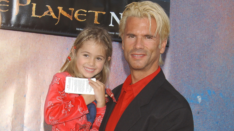 Lorenzo Lamas posing with his daughter Alexis Lamas at the premiere for 