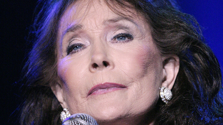 Loretta Lynn performing at a concert